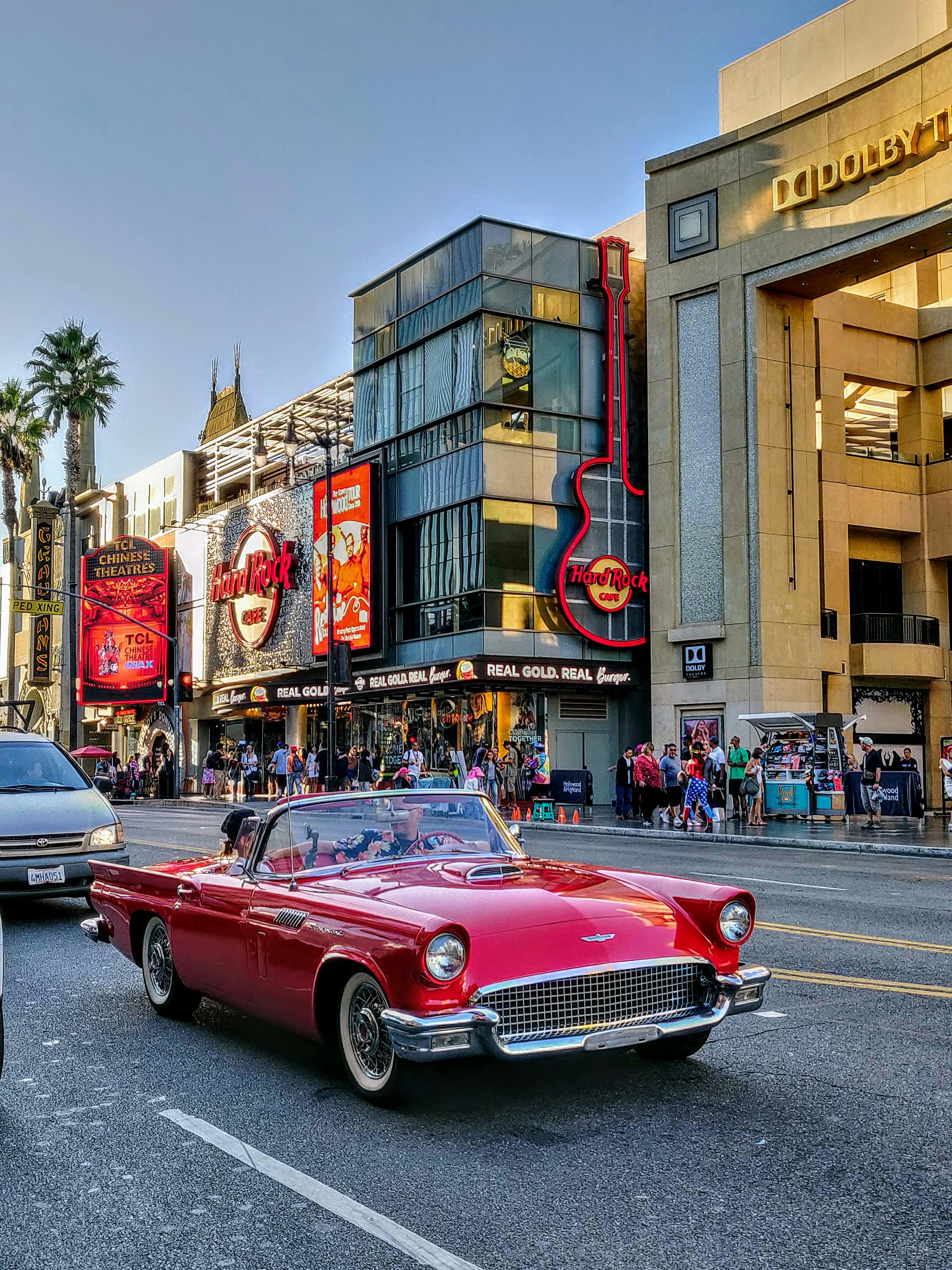 red convertible car on road during daytime