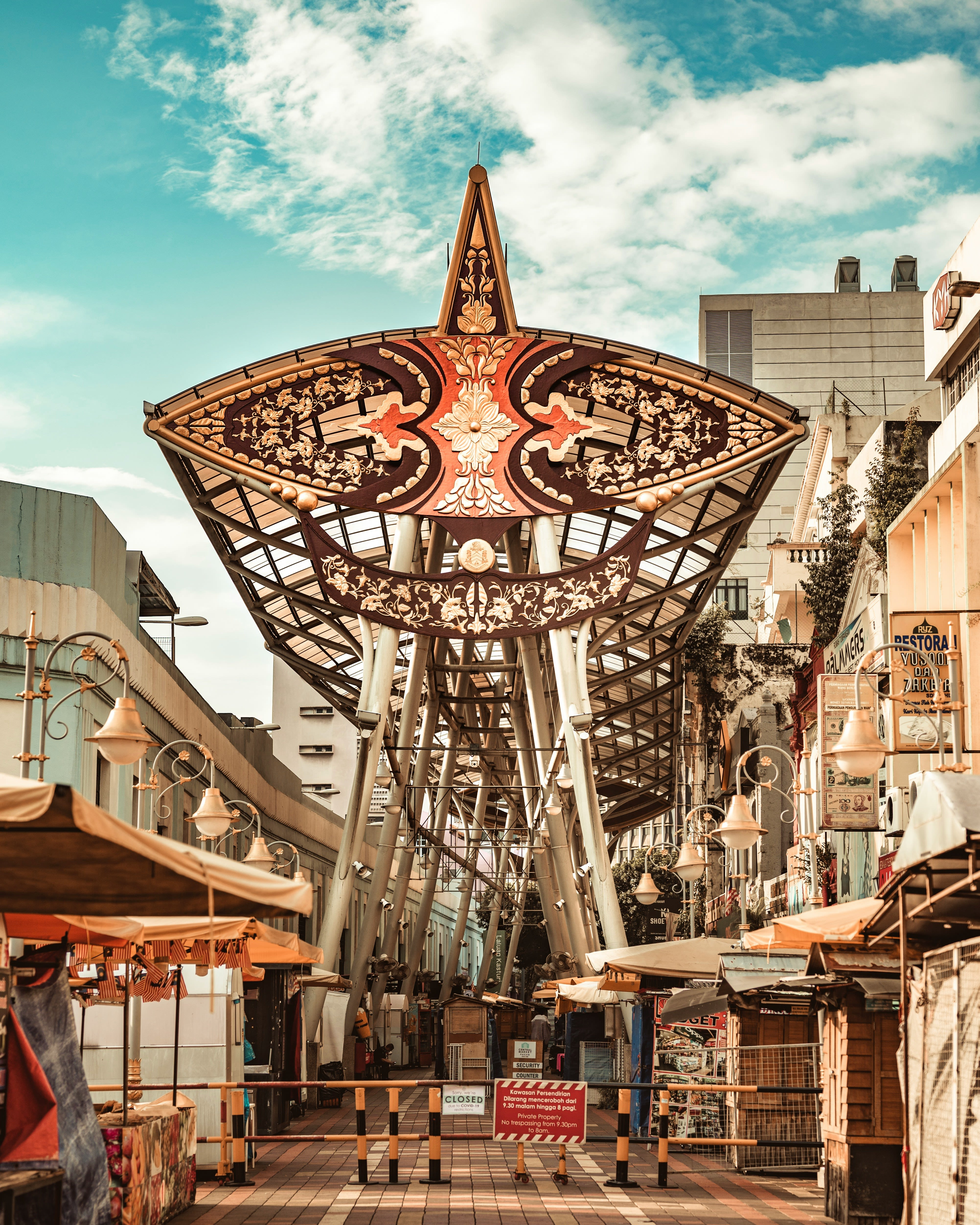 people walking on market near brown concrete building during daytime