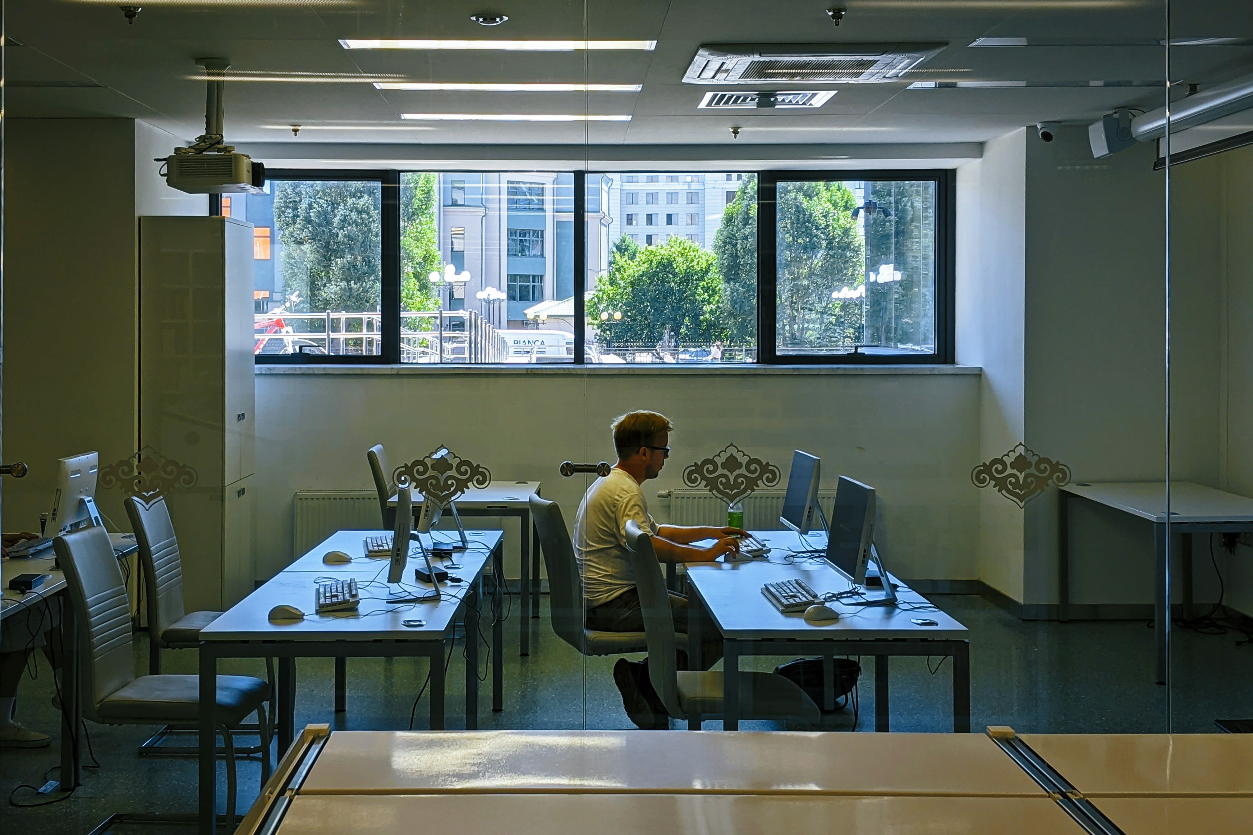 a man sitting at a desk in an office